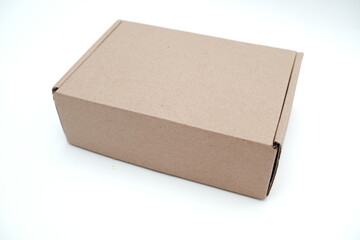 small brown paper box or cardboard box isolated on white background