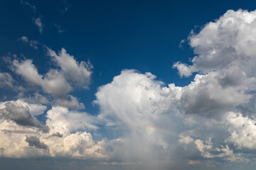 Blue sky with white clouds. Bright summer skyscape