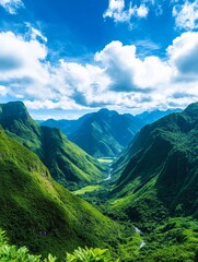 Serene Mountain Valley Landscape - Lush green mountains and a winding river create a breathtaking natural scene under a bright blue sky