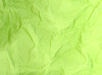 Light green crumpled tissue paper texture background detail