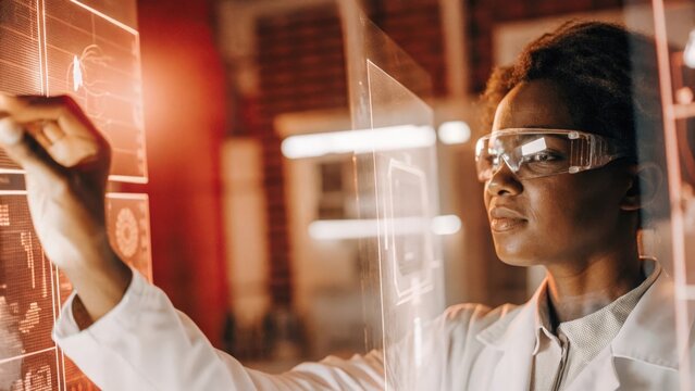 A researcher in a lab coat adjusts a holographic interface with screens of analytics data reflecting in their glasses and the soft glow of the holograms lighting the surrounding