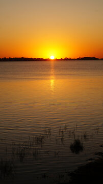 Landscape view of a beautiful sunset over Chascomus lake, Buenos Aires   
