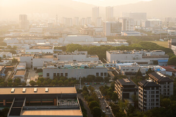 Aerial View of a Modern Industrial Cityscape at Sunset