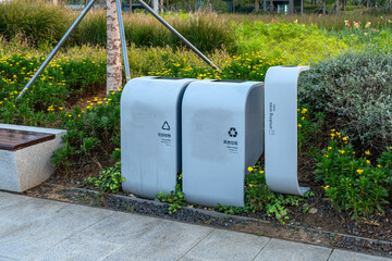 Modern Recycling Bins in a Lush Urban Park Setting