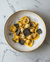 fresh tortellini with black truffle shavings