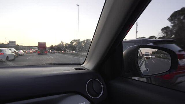 video of the rear-view mirror showing traffic and car circulation