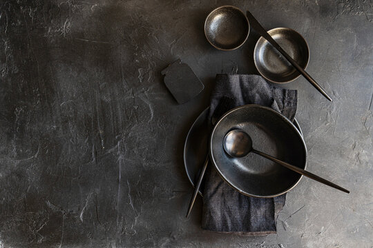 Black crockery on a dark background