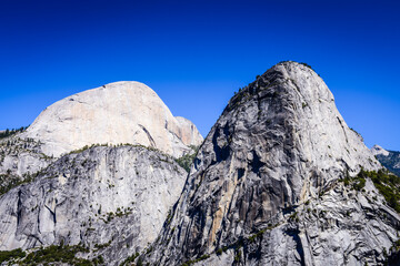 Scenic view of  Liberty Cap, with Half Dome behind it, from Clark Point in Yosemite National Park.