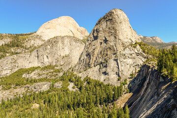 Scenic view of Nevada Falls, with Liberty Cap and Half Dome behind it, from Clark Point in Yosemite National Park.