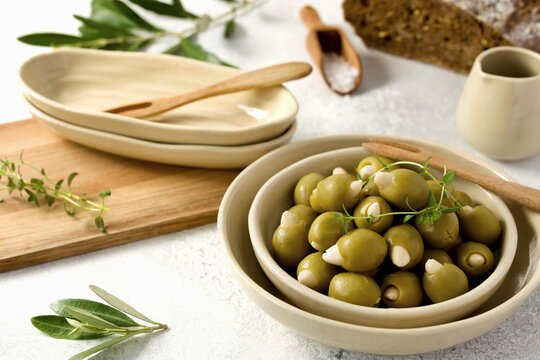 A bowl with almond-stuffed green olives.