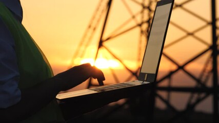 silhouette electrical engineer, work computer tablet sunset, electric tower, digital hand, work concept, engineering design, industrial factory, silhouette worker, data checks, telecommunications - Powered by Adobe