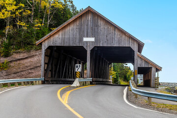 A view towards the covered bridge on main street at Vaughan Creek, New Brunswick in the fall