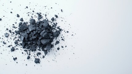 Crumbled dark gray eyeshadow scattered powder makeup texture artistic mess abstract background