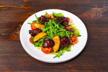 Gourmet salad with cherry tomatoes and rich dressing