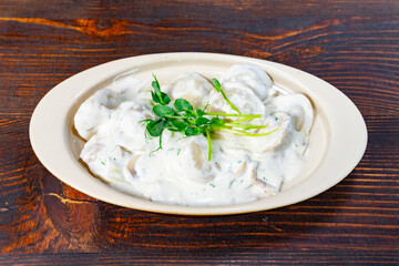 Creamy dish served in a bowl on a wooden table