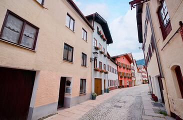Charming European Village Street With Colorful Buildings and Cobblestone Path