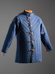 Historical fashion. Medieval knight cloth. Padded jacket gambeson.