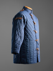 Historical fashion. Medieval knight cloth. Padded jacket gambeson.