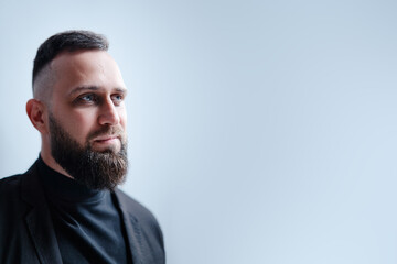 Obraz premium Studio portrait of young handsome man with beard.