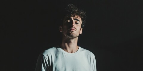 Fototapeta premium A Confident Portrait Captured in Dark Lighting That Evokes Strong Emotions and Attitudes