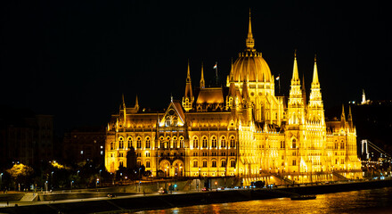 A grand and impressive Budapest's Parliament is illuminated at night