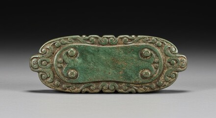 A green nephrite jade plaque intricately carved with scrollwork and circular motifs. The oval shape features a central panel bordered by elaborate detailing. Ancient Chinese artistry.