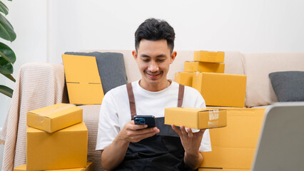 Small business owner packing boxes for online orders ready for shipping, Man taping cardboard boxes for shipping, Preparing to send packages, preparing/packing boxes of online orders