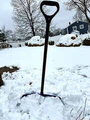snow covered shovel