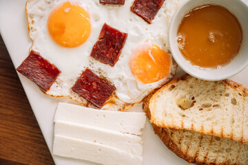 fried eggs with sausage for breakfast.