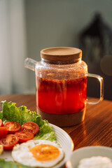 Egg with waffles and raspberry tea for breakfast.