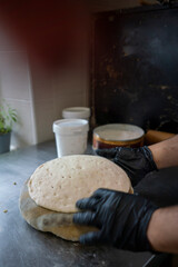 Chef preparing naan bread in indian restaurant kitchen