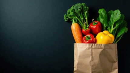 A brown paper bag overflowing with fresh produce vibrant bell peppers, a crisp carrot, and a bunch of broccoli, all against a dark background.