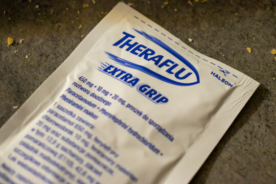Warsaw, Poland - January 19, 2025: A close-up of a TheraFlu packet on a textured surface, representing health and wellness solutions during illness