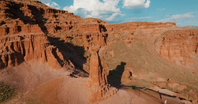 Unique rock formations rising in Erzurum Narman Fairy Chimneys. The drone is flying around.