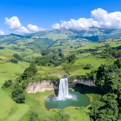 Fototapeta premium Aerial View Of Waterfall In Lush Green Valley