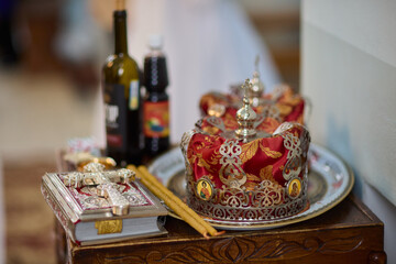 A ceremonial table with a crown and wine, symbolizing faith and community connection