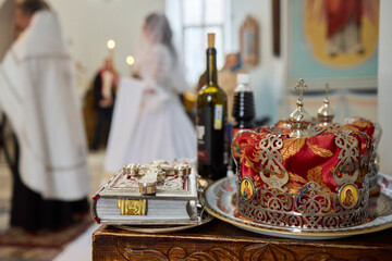 A ceremonial table with a crown and wine, symbolizing faith and community connection