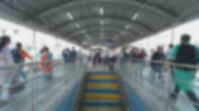 Blurred time lapse video of human traffic at Andheri West Railway Station in Mumbai, India