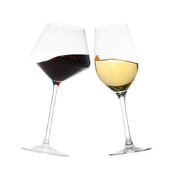 Glasses of splashing wine isolated on white