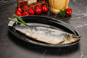Whole raw salted herring fish