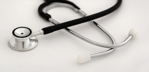 Medical stethoscope detail on neutral background