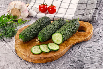 Raw green cucumbers with slices
