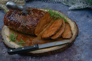 Roasted seitan rubbed with spices and bbq sauce on wooden board, sliced, copy space