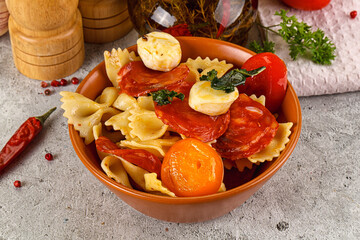 Italian pasta farfalle with pepperoni
