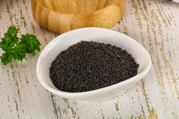 Black dry Nigella seeds in the bowl