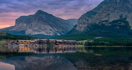 Many Glacier Hotel resort reflection at Swiftcurrent Lake - Blue Hour - Glacier National Park 