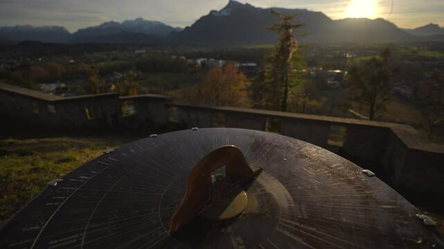 Mountain view from monchsberg hill from pointer or compass at sunset in sunny winter weather, Salzburg, Austria. Josefsturm. Bertoldsturm, Stadttor. Bertolds Zwinger. Mittelalter. Directional signpost