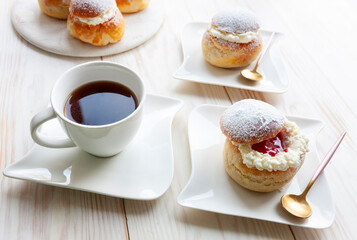 Homemade Semla or semlor, vastlakukkel, laskiaispulla - traditional Scandinavian sweet bun especially Fastelavn Shrove Monday and Shrove Tuesday.