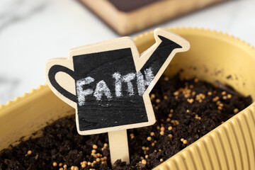 Mustard seeds in soil with handwritten word 