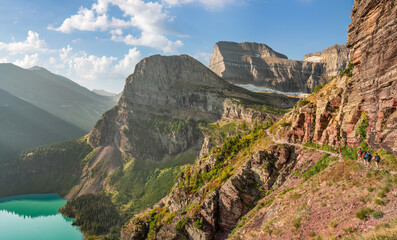 Glacier National Park - hikers on the Grinnell Glacier Trail - Angel Wing and Mount Gould in the background	